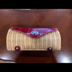 Dark red and woven clutch